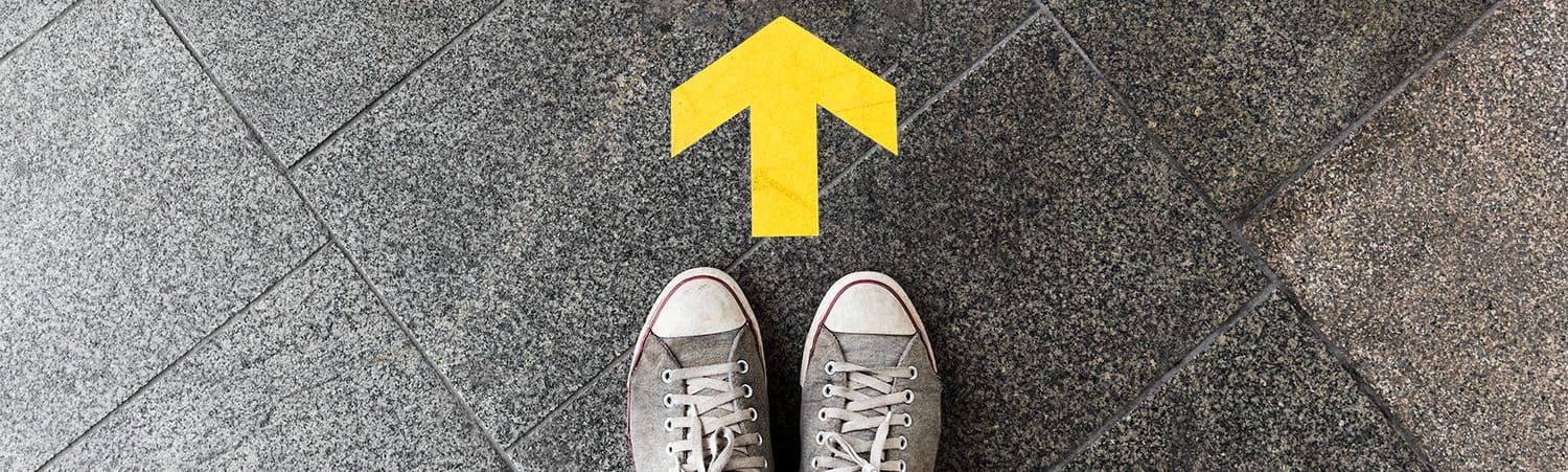 Floor with yellow arrow pointing upwards towards the study buddy website logo.