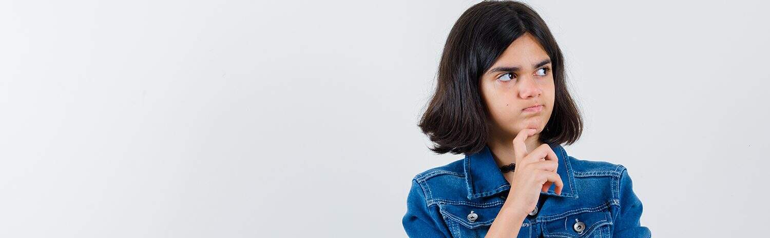 Being a girl in a denim jacket thinking deeply about the best way to study with The Study Buddy website for effective learning.