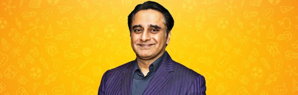 Smart man in a dark purple suit smiling against a bright yellow background with educational icons, showcasing The Study Buddy platform for effective learning support.